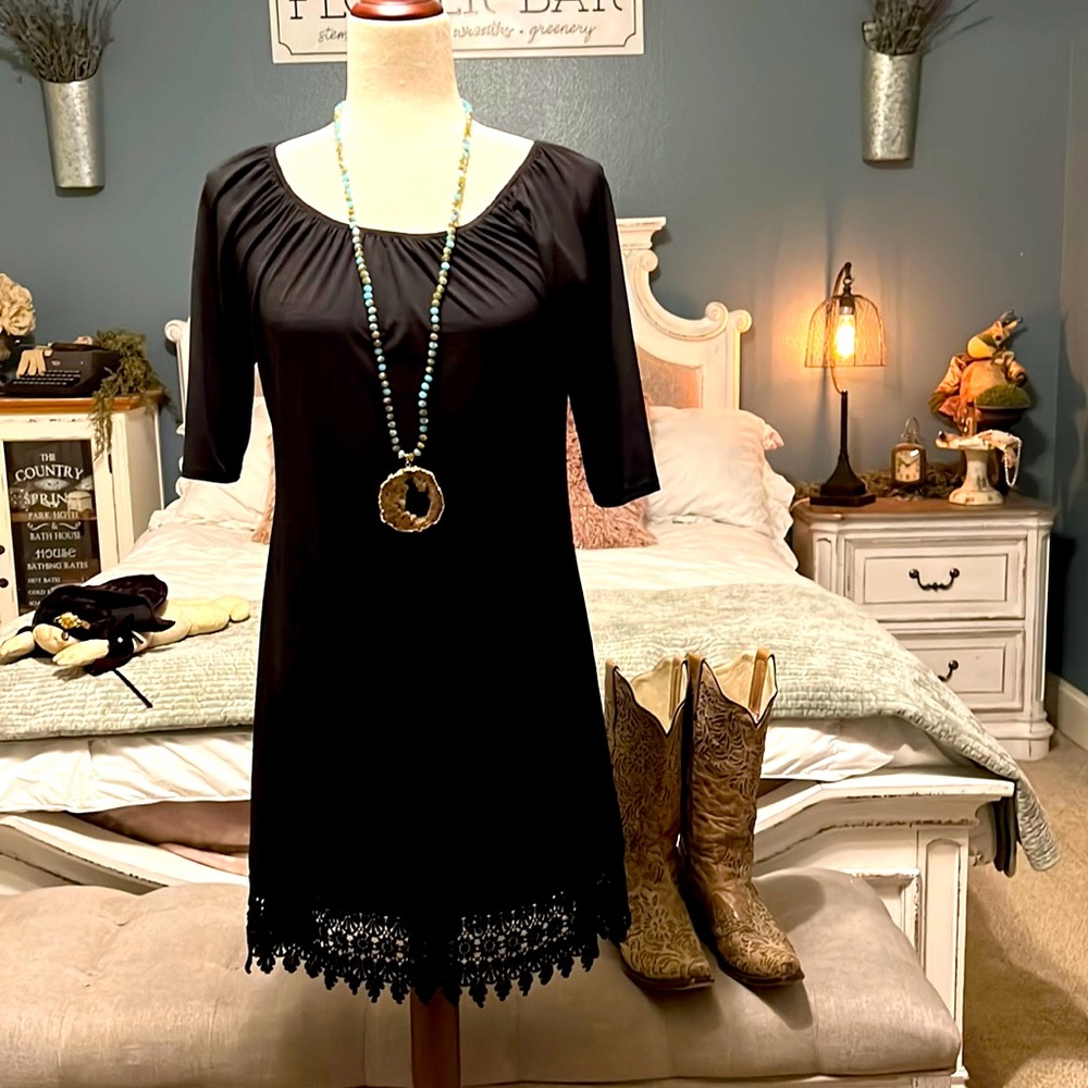 The ultimate black dress.  Lace bottom. In excellent condition. So cute on!